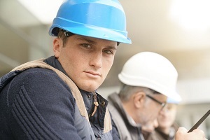 Portrait of young man in construction industry training